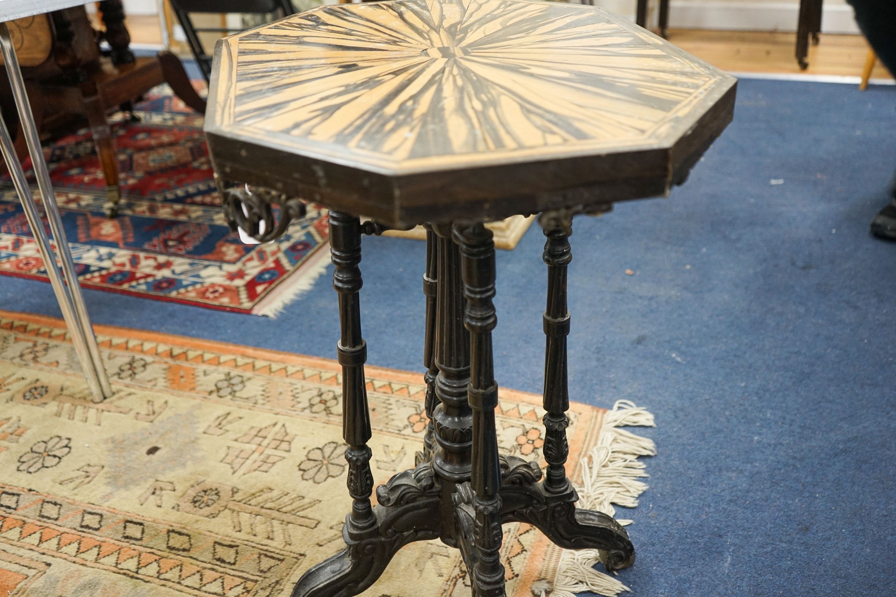 A 19th century Celanese carved ebony and coromandel veneered octagonal occasional table, width 57cm, depth 42cm, height 70cm